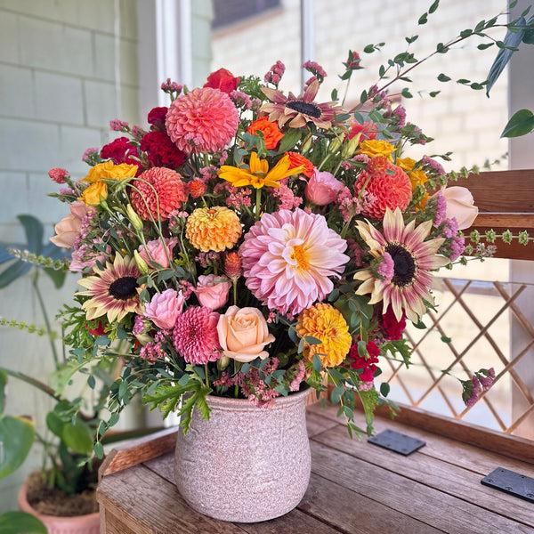 Joyful Regal Arrangement with dahlias, sunflowers, roses, marigold, rudbeckia, and more.